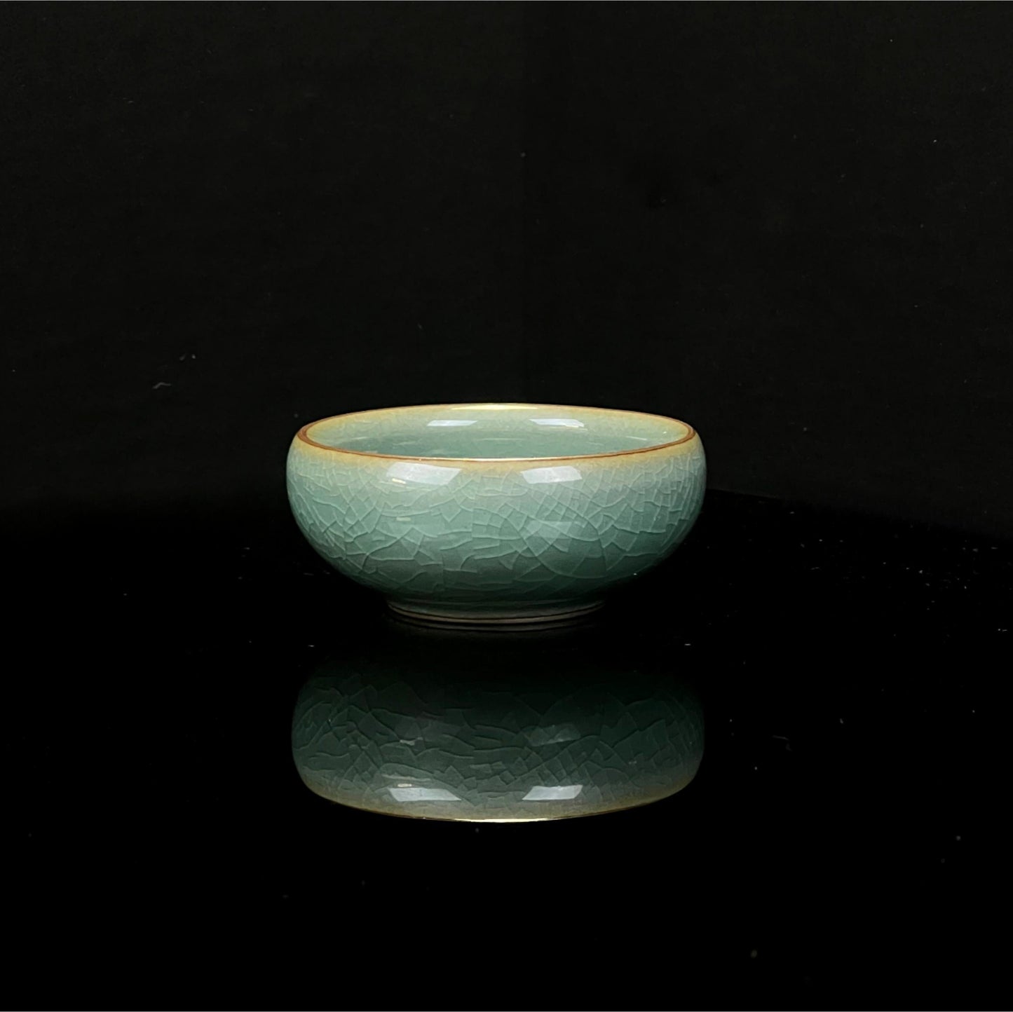 Longquan celadon Ge kiln plum green "Little Fish" Gongfu tea cup.