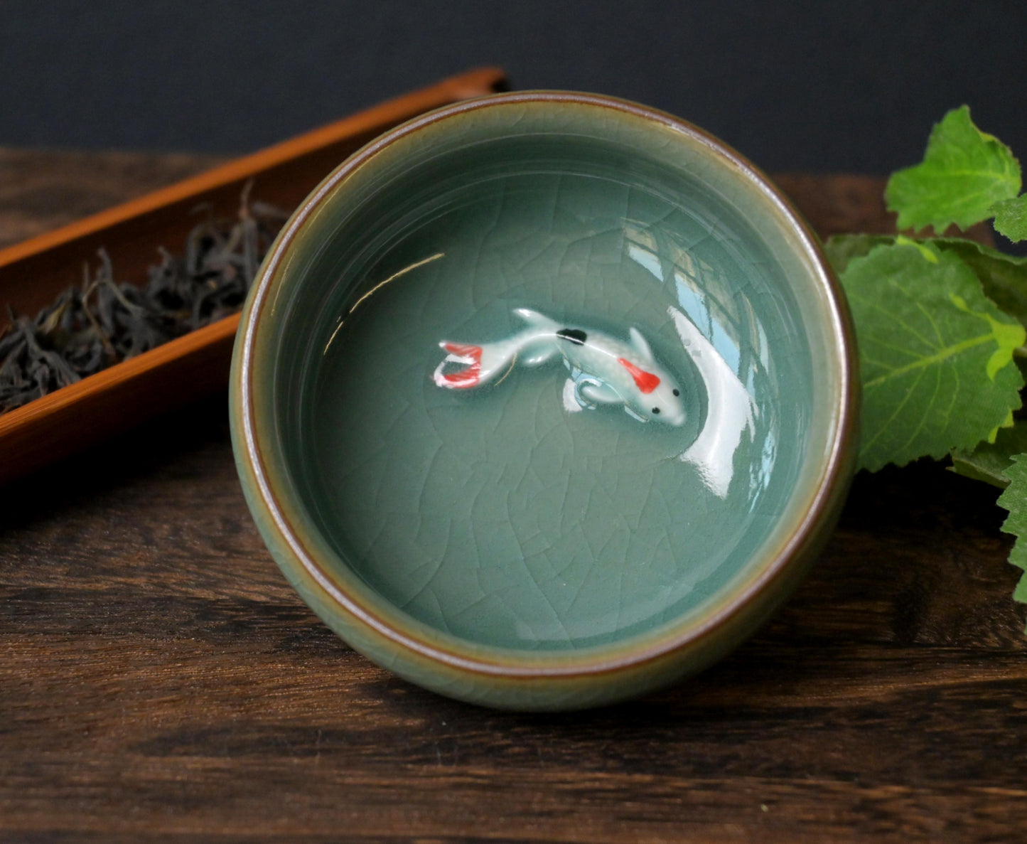 Longquan celadon Ge kiln plum green "Little Fish" Gongfu tea cup.