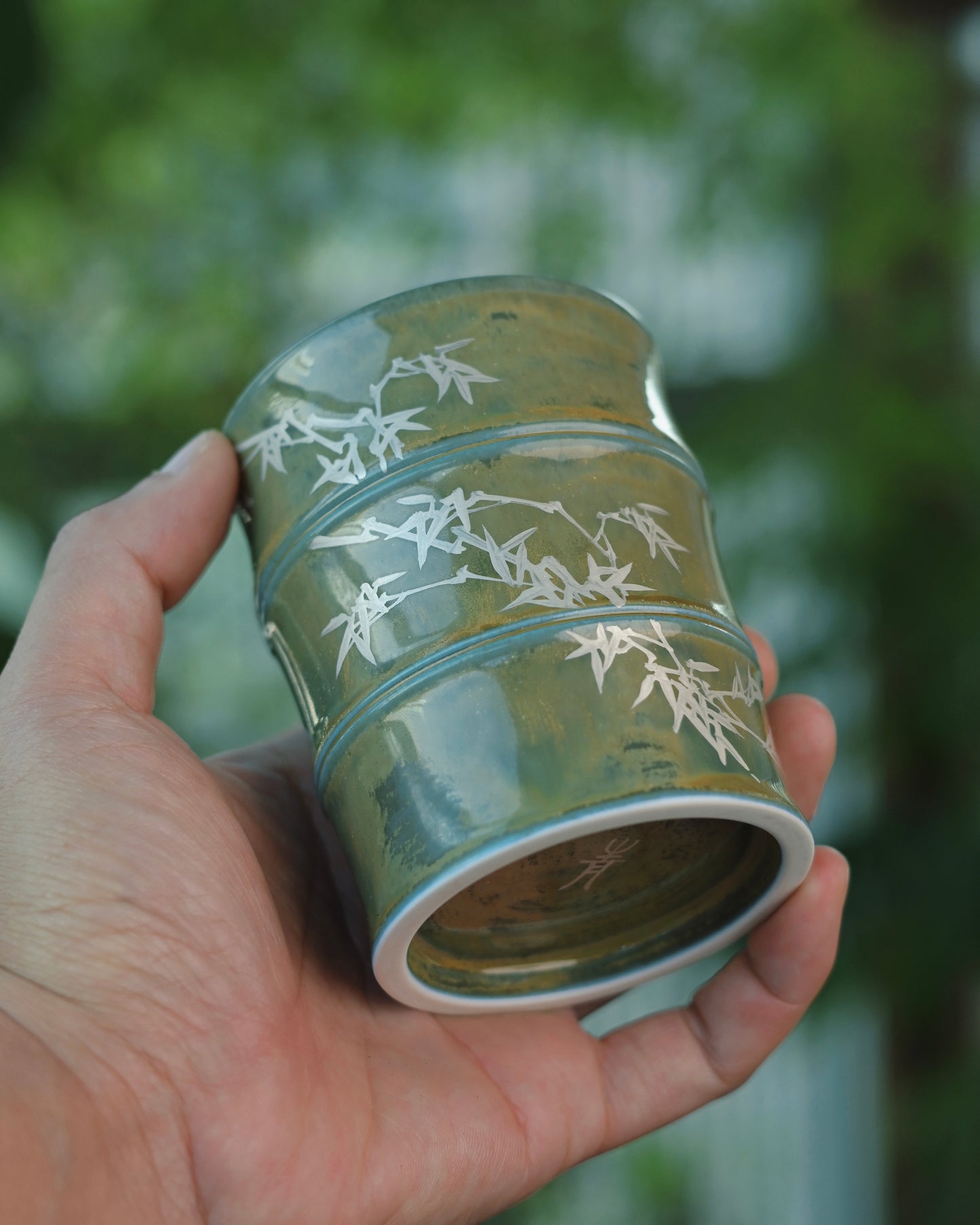 Close-up detail of the bamboo motif, meticulously hand-painted using pure silver powder on a high-temperature glazed surface