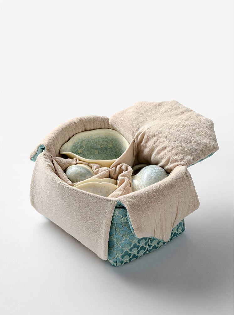 Ceramic teapot and teacup with smoky cyan glaze, traditional kiln-change finish
