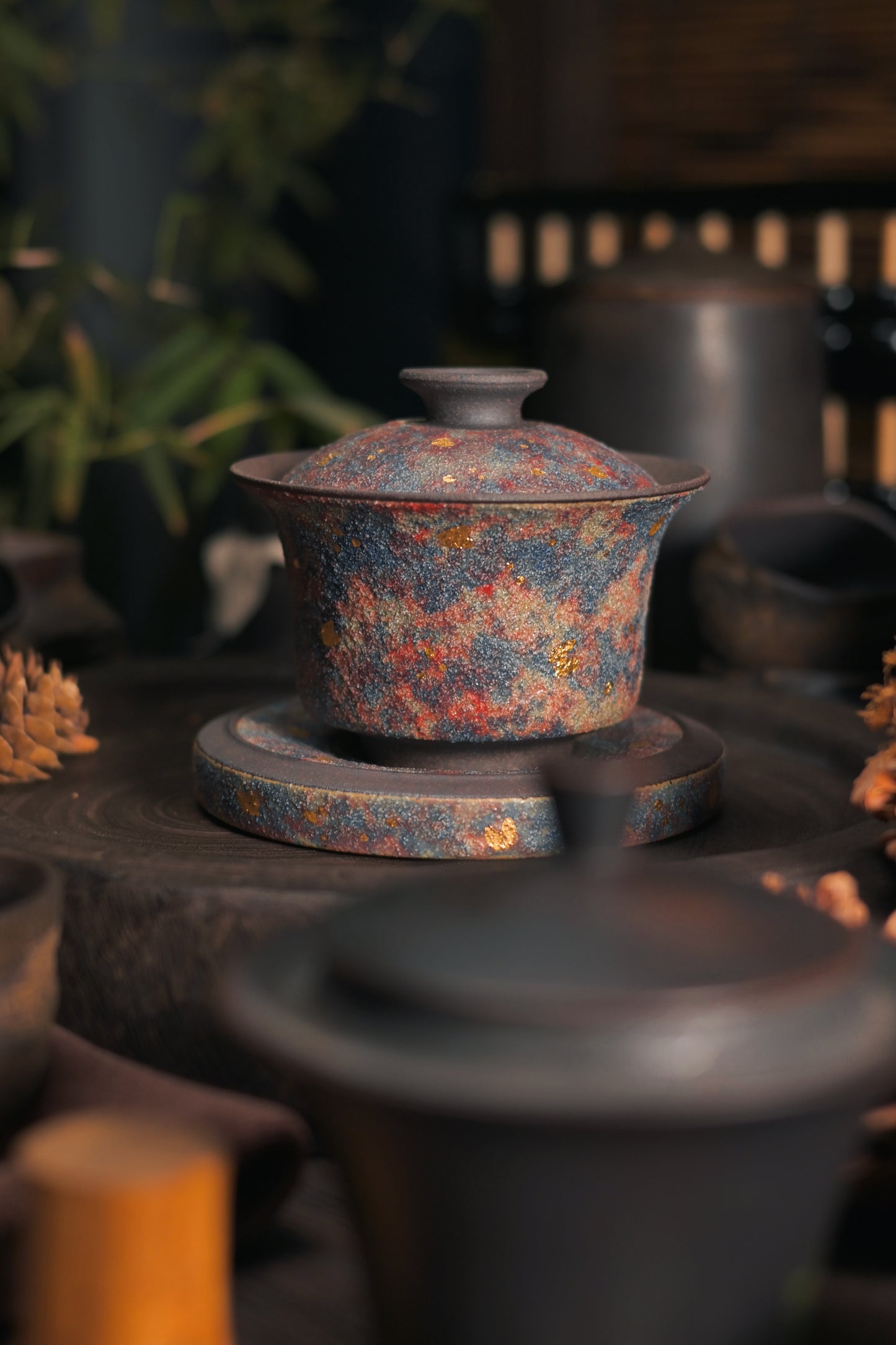 Premium aged zini clay gaiwan featuring sparkling mineral gold decoration, representing the pinnacle of Yixing craftsmanship for luxury gifting.
