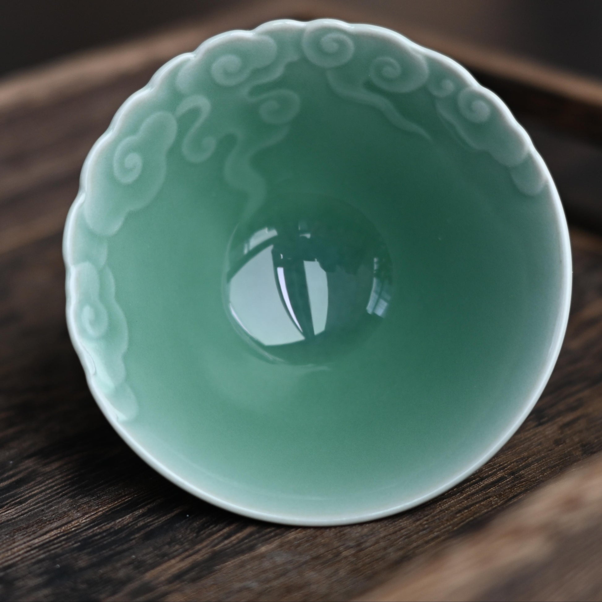 Ancient cloud motif tea cup in plum celadon, embodying traditional Chinese cultural symbols in modern tea ware