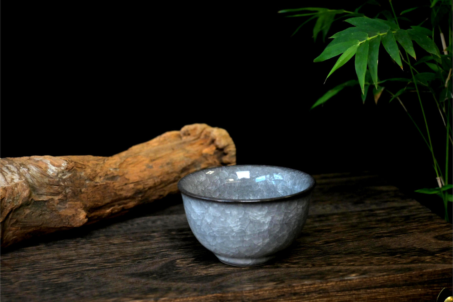 Chinese celadon ice crackle glazed tea cup with ergonomic ya shou design and natural crackle network