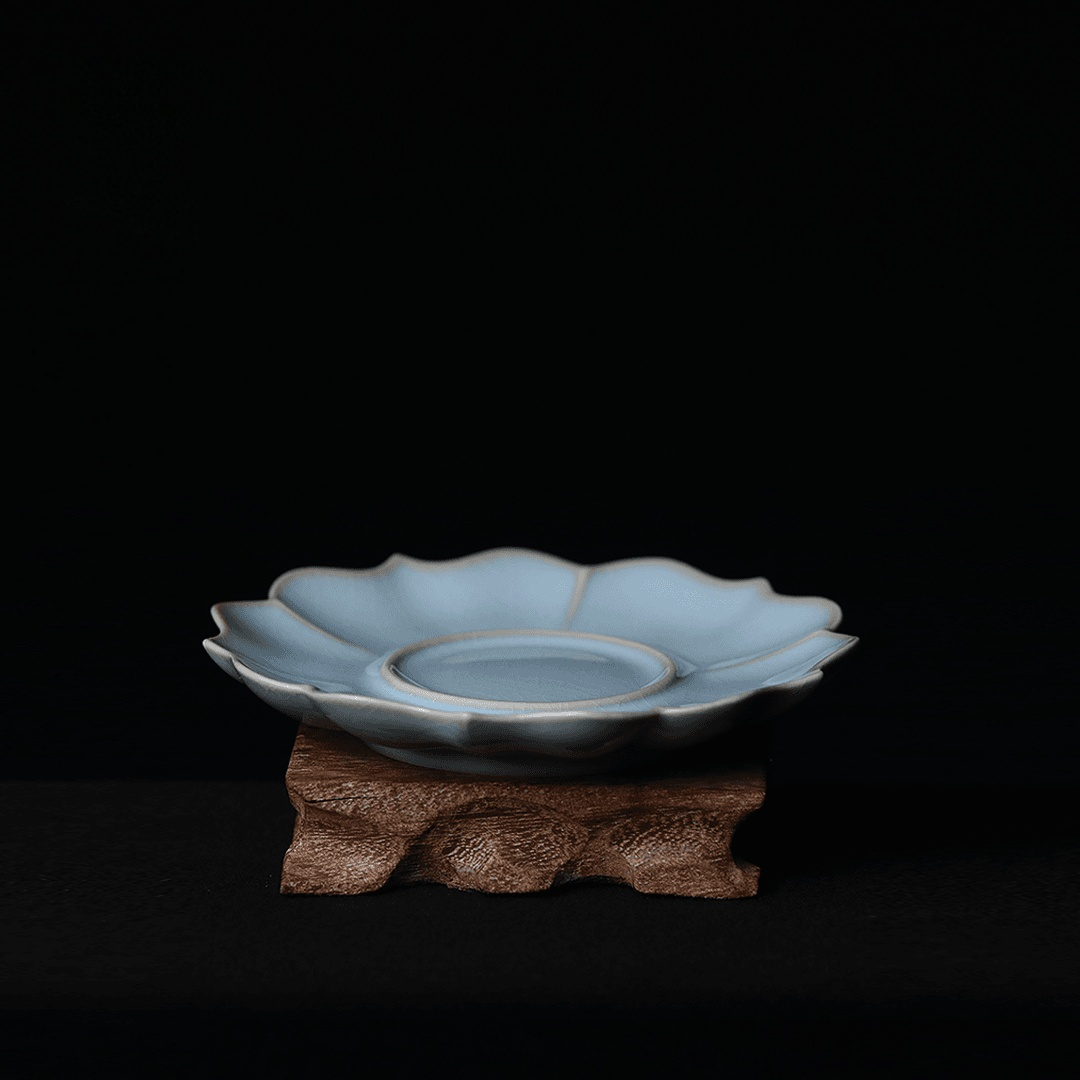 Handcrafted Ru porcelain teacup saucer with eight-lobed sunflower rim and signature sky-after-rain glaze coloration