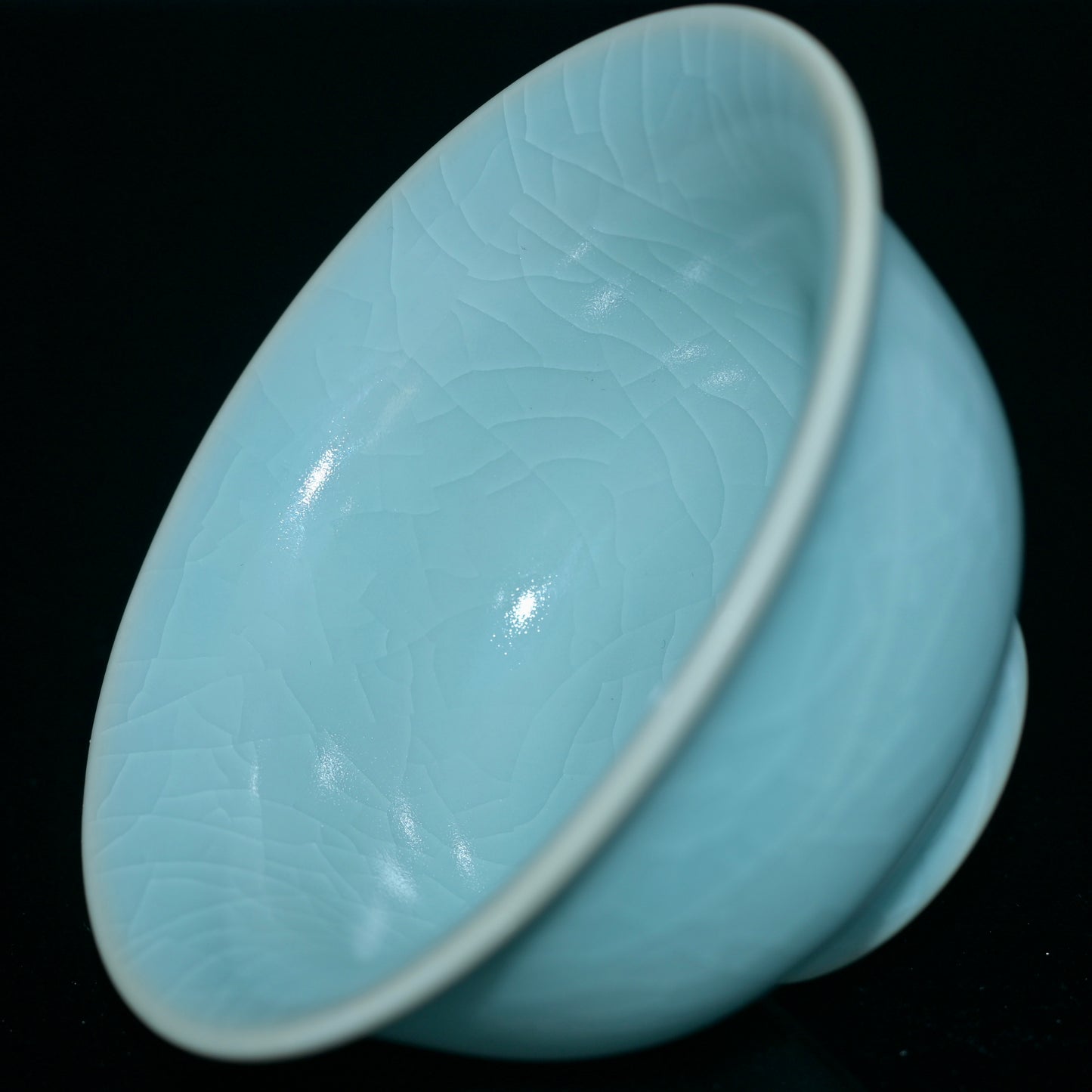 Fully glazed Ru porcelain cup using nail technique, featuring smooth round body and noble press-hand design