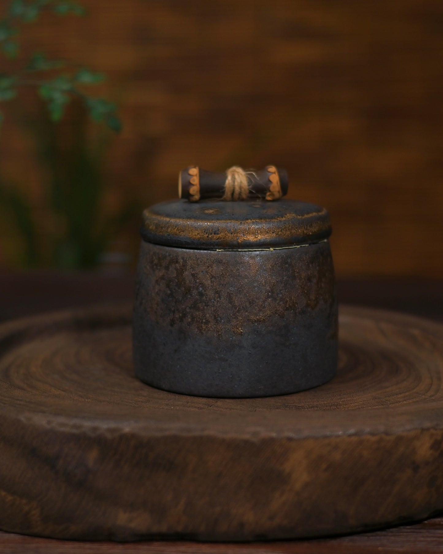 Exquisite small Chinese tea caddy with gold accents and traditional patterns.