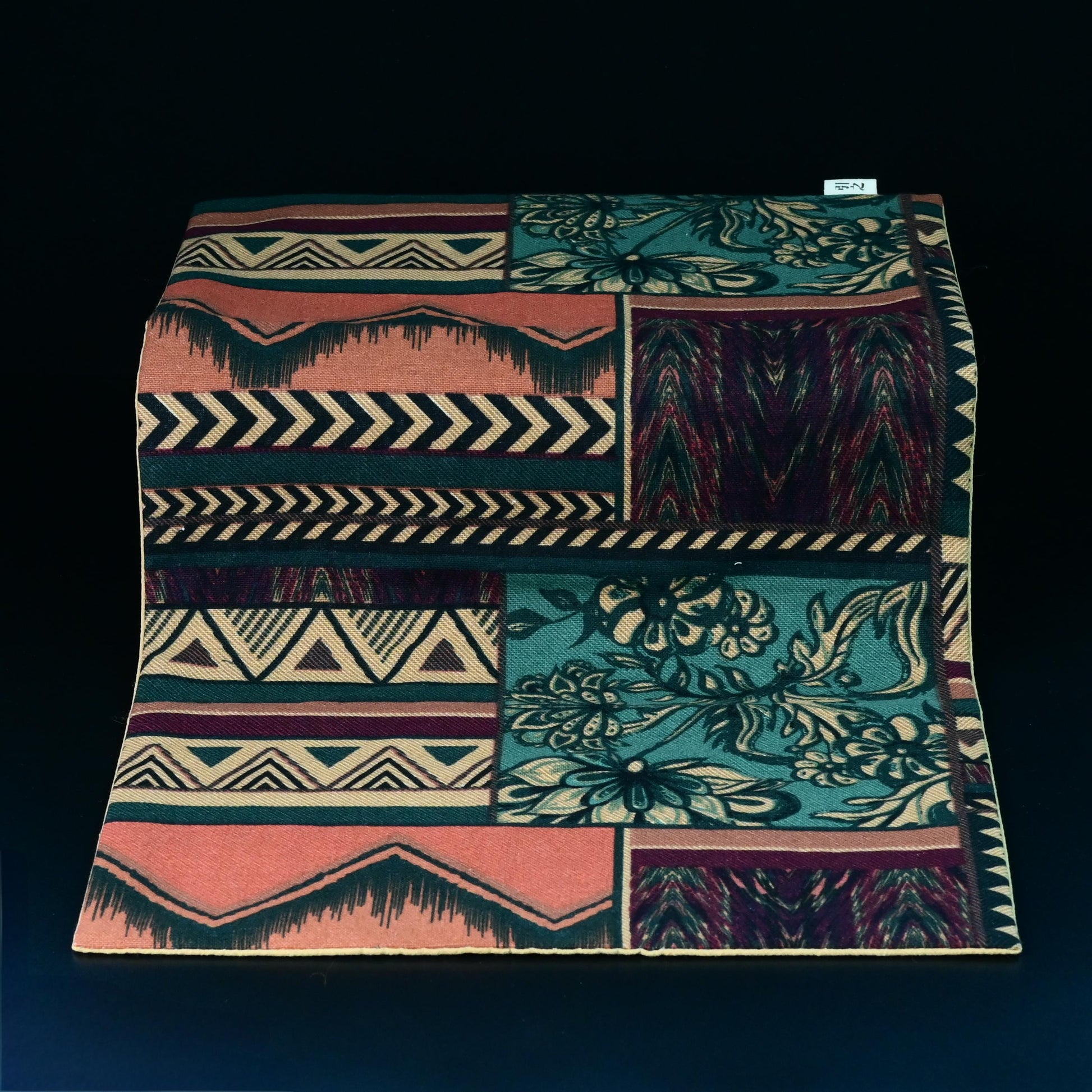 Decorative ethnic-style tea table cloth accessory for home tea ceremony.