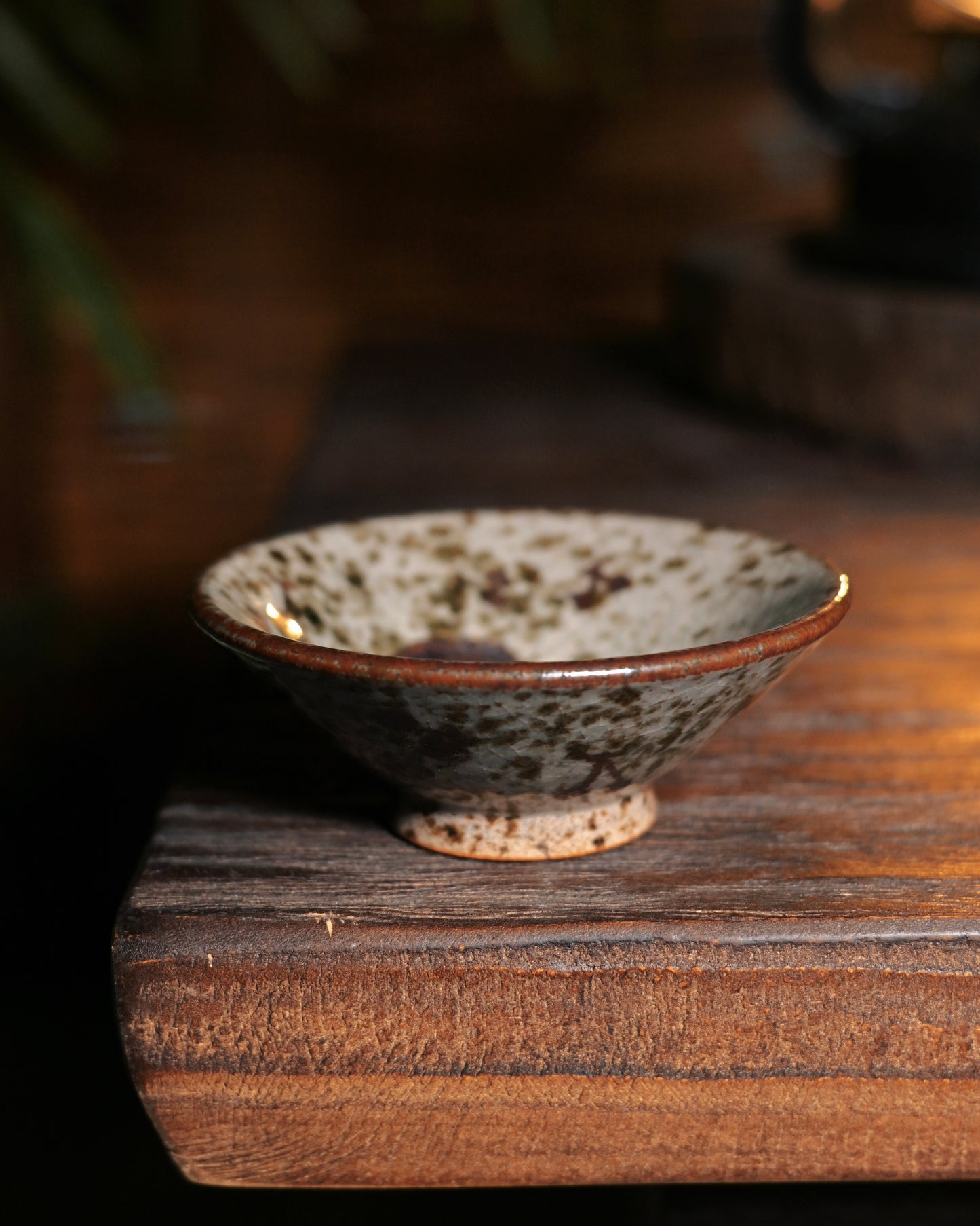 Natural wood ash glazed cup with fine surface crackles, embodying minimalist beauty through traditional firing