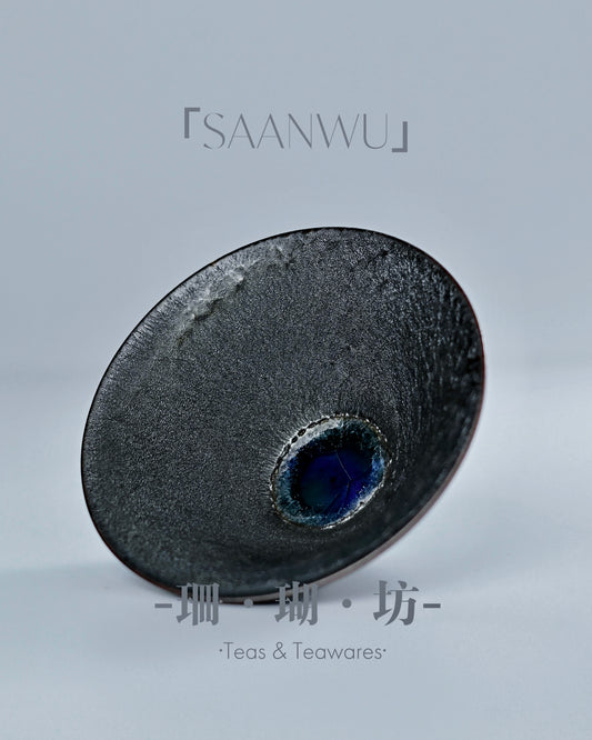 Crystalline sapphire-blue glaze pool formed naturally inside cup during 1300°C wood kiln firing