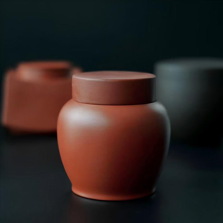 Small Yixing zisha tea caddy with 250ml capacity, minimalist design for portable tea storage and outdoor use