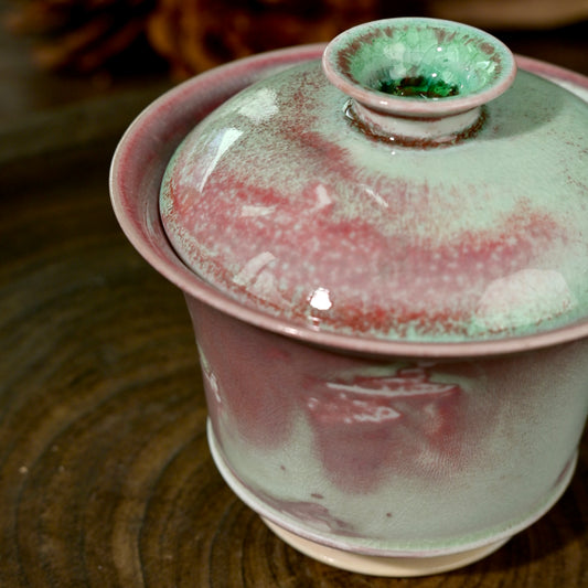 Handmade wood-fired soda glaze tea bowl 100ml with unique flame marks and subtle glaze cracking