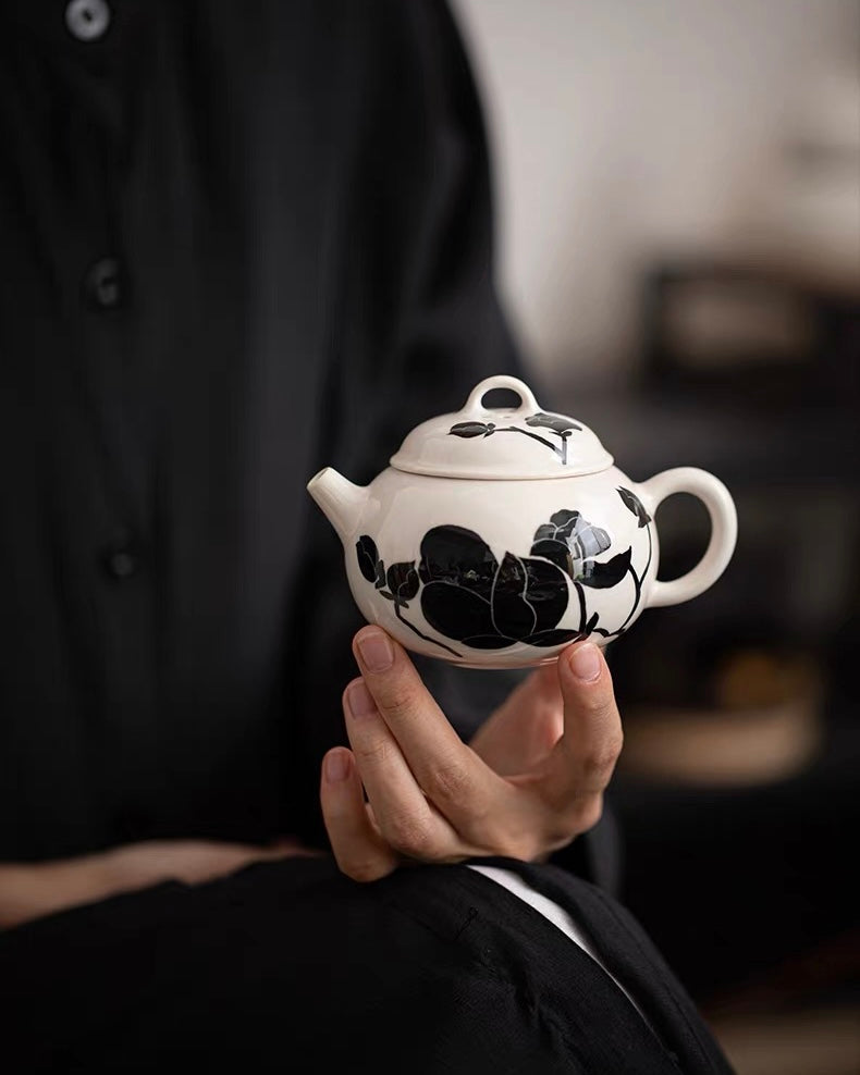 Gift-ready magnolia teapot in elegant packaging - includes protective box and care guide for special occasions