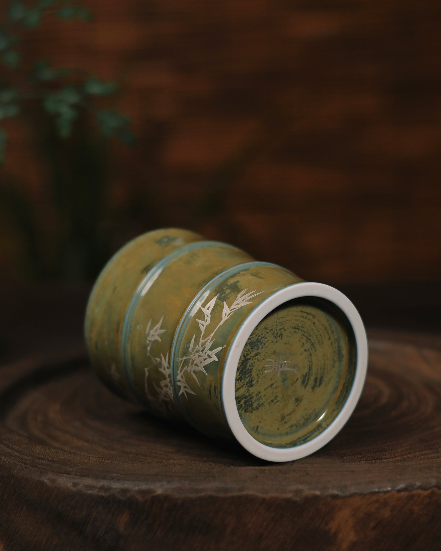 The 'Bamboo Rhythm' mug in a cozy tea-time setting, paired with loose-leaf tea and natural wooden accessories