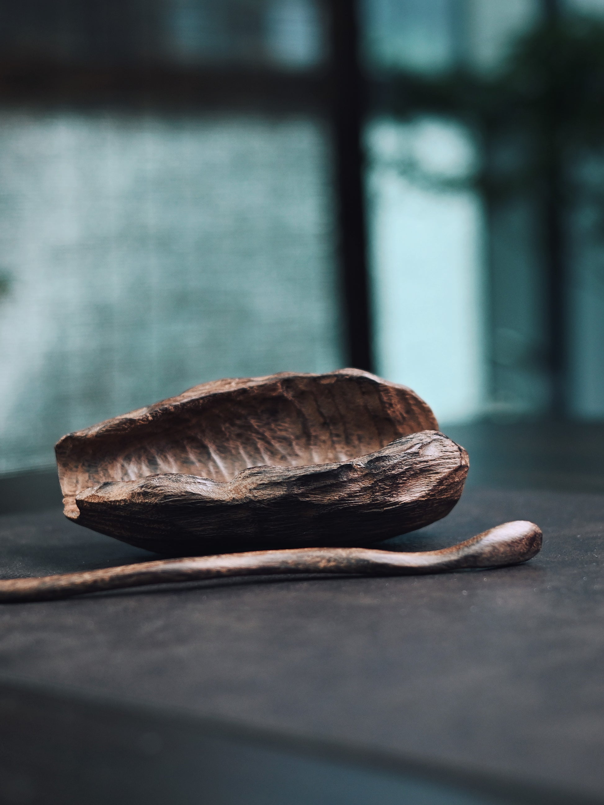 Handcrafted wooden tea scoop with organic irregular shape, carbonized finish for tea ceremony use