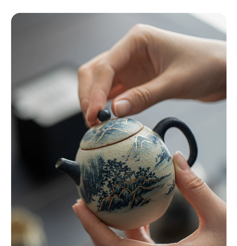 Handcrafted from fine porcelain, the Dragon Egg Teapot captures the essence of Chinese artistry — gentle blues, gilded lines, and timeless serenity in every curve.