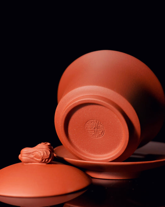 Yixing Clay gaiwan hand-pinched cabbage button knob showing sculptural detail and ergonomic grip design