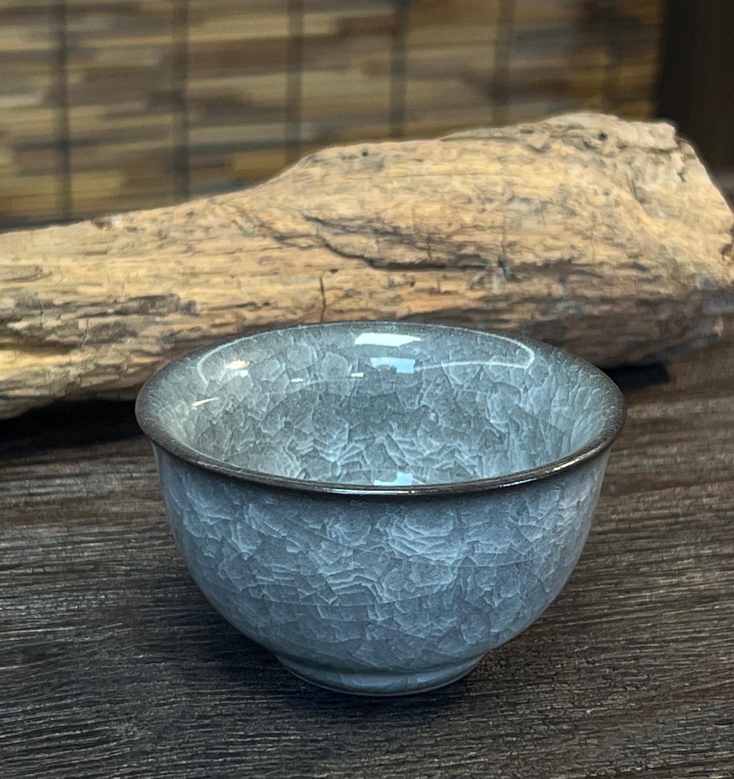 Hand-thrown Longquan celadon ya shou cup with natural ice crackle patterning and ideal weight distribution