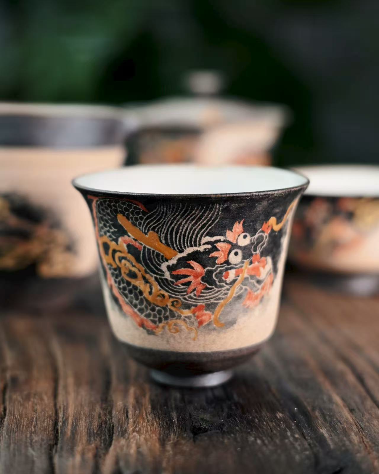 Premium Jingdezhen clay teacup with traditional dragon relief carving, food-safe glaze, and ergonomic shape for gongfu tea.
