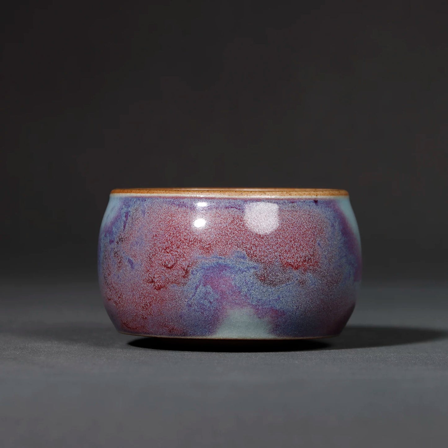 Handcrafted Jun Ware Starry Galaxy Violet Yuanrong Porcelain Teacup 110ML in a studio shot.