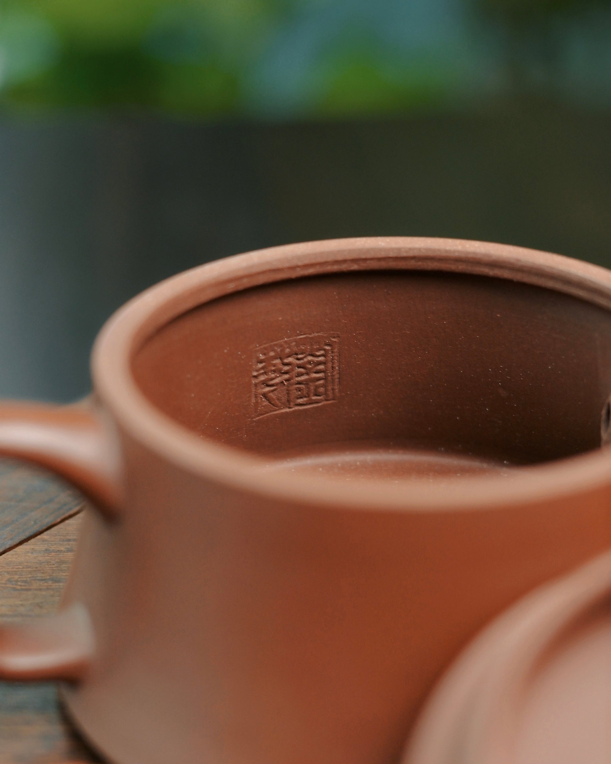 Artisan shaping the Yixing Zisha teapot from natural Dicao Qing ore clay