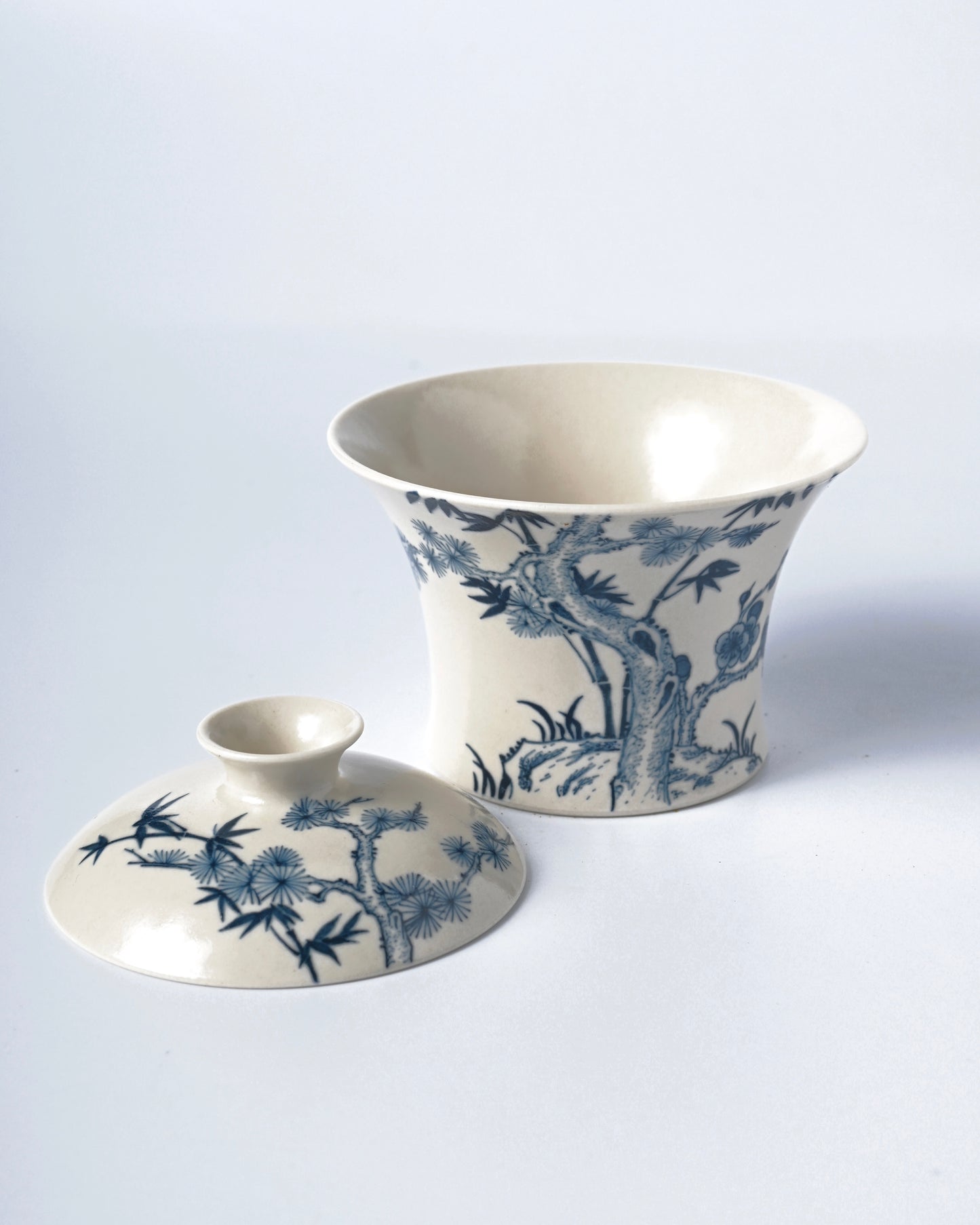 Horseshoe-shaped covered bowl with cobalt blue patterns