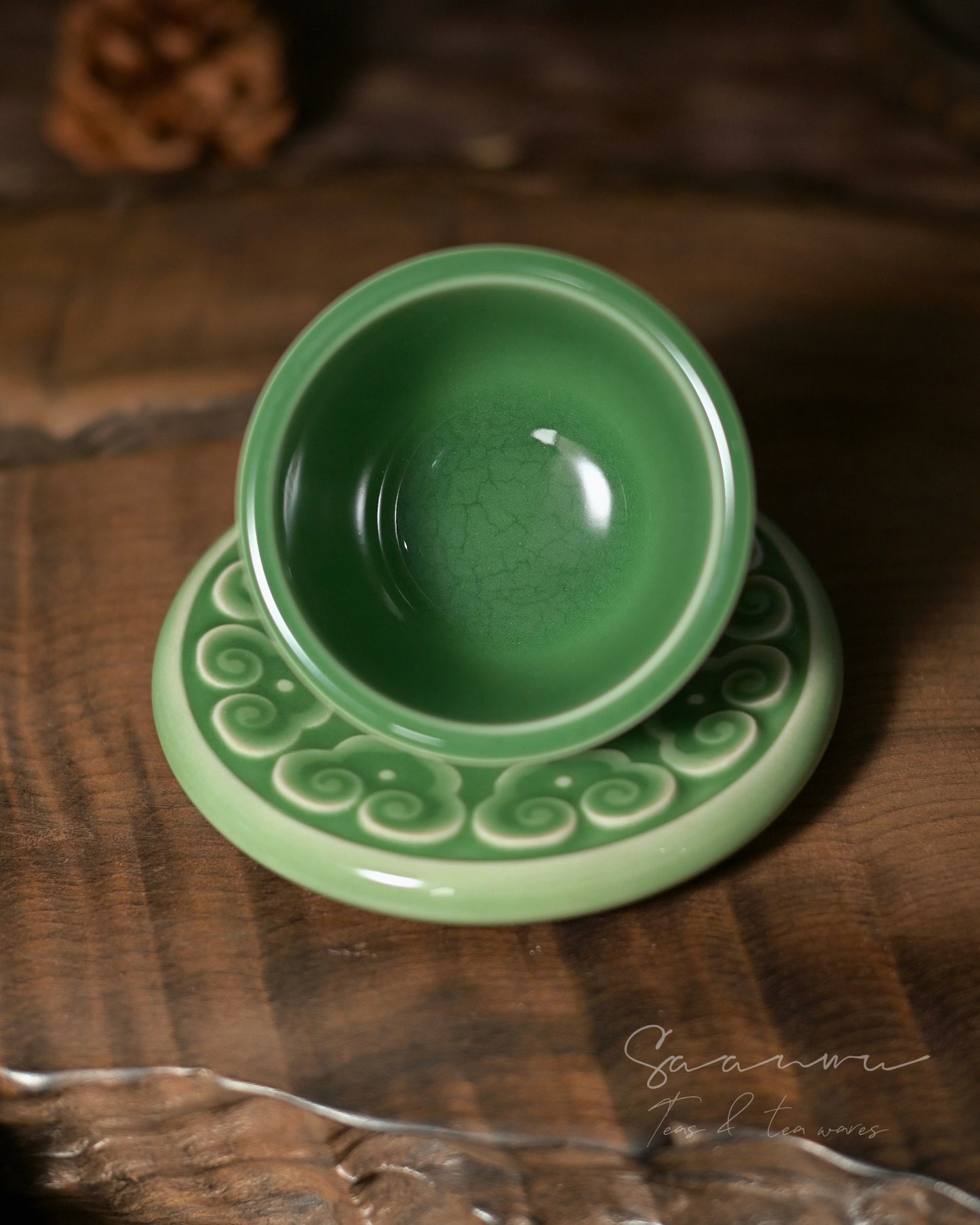 Imperial style Longquan celadon teacup set with plum green glaze and classic Chinese carved ornament.