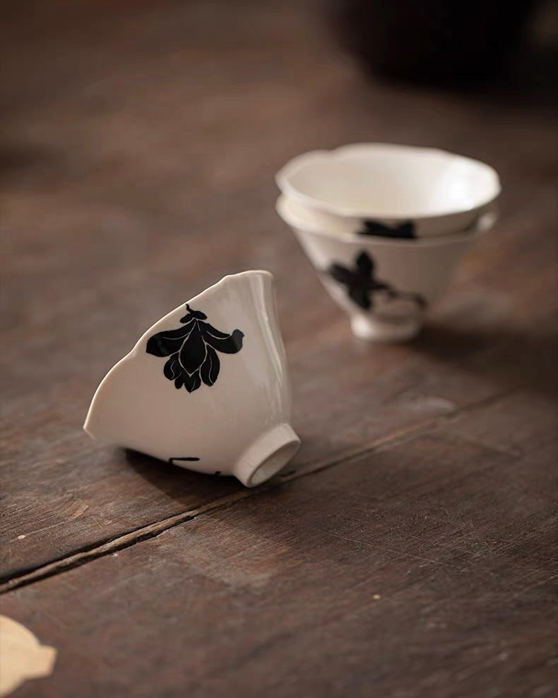 Minimalist conical cup featuring single magnolia bloom, fired at high temperature for durability