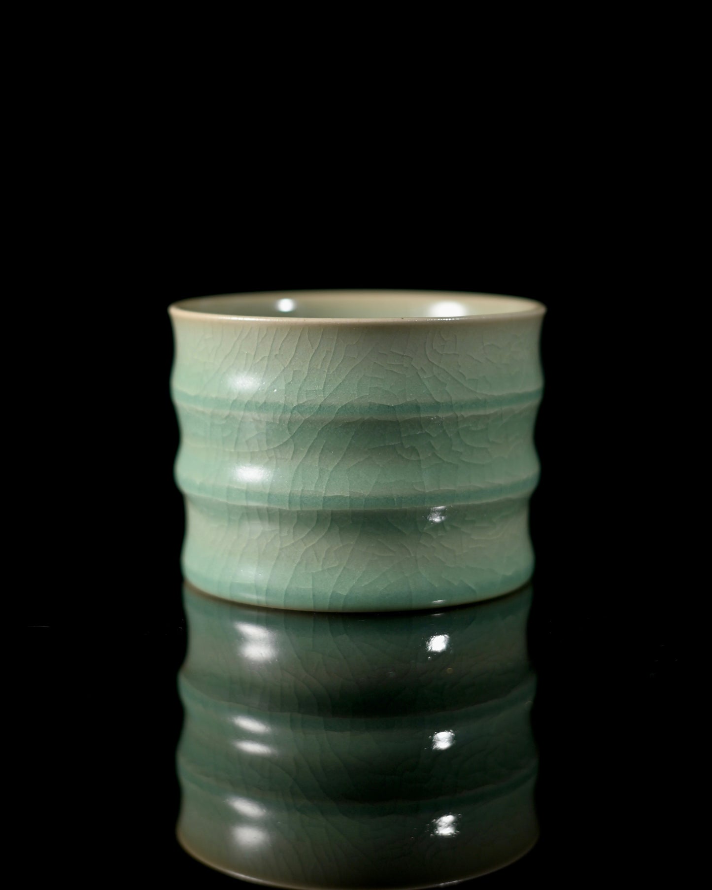 Jadeite-glazed Ru ware cup with bamboo joint design, combining ancient crackle artistry with modern functionality