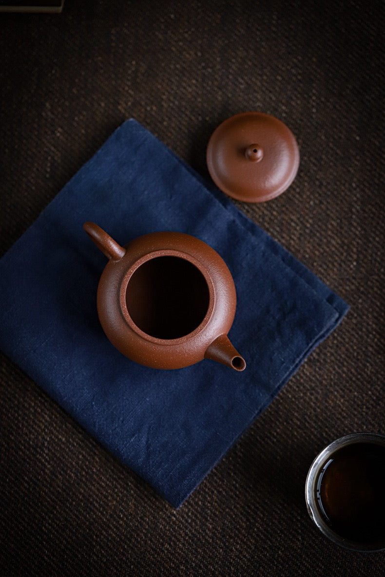 Yixing teapot from buried mine Jiangpo clay, refined to show aged orange-red hue with yellow tones