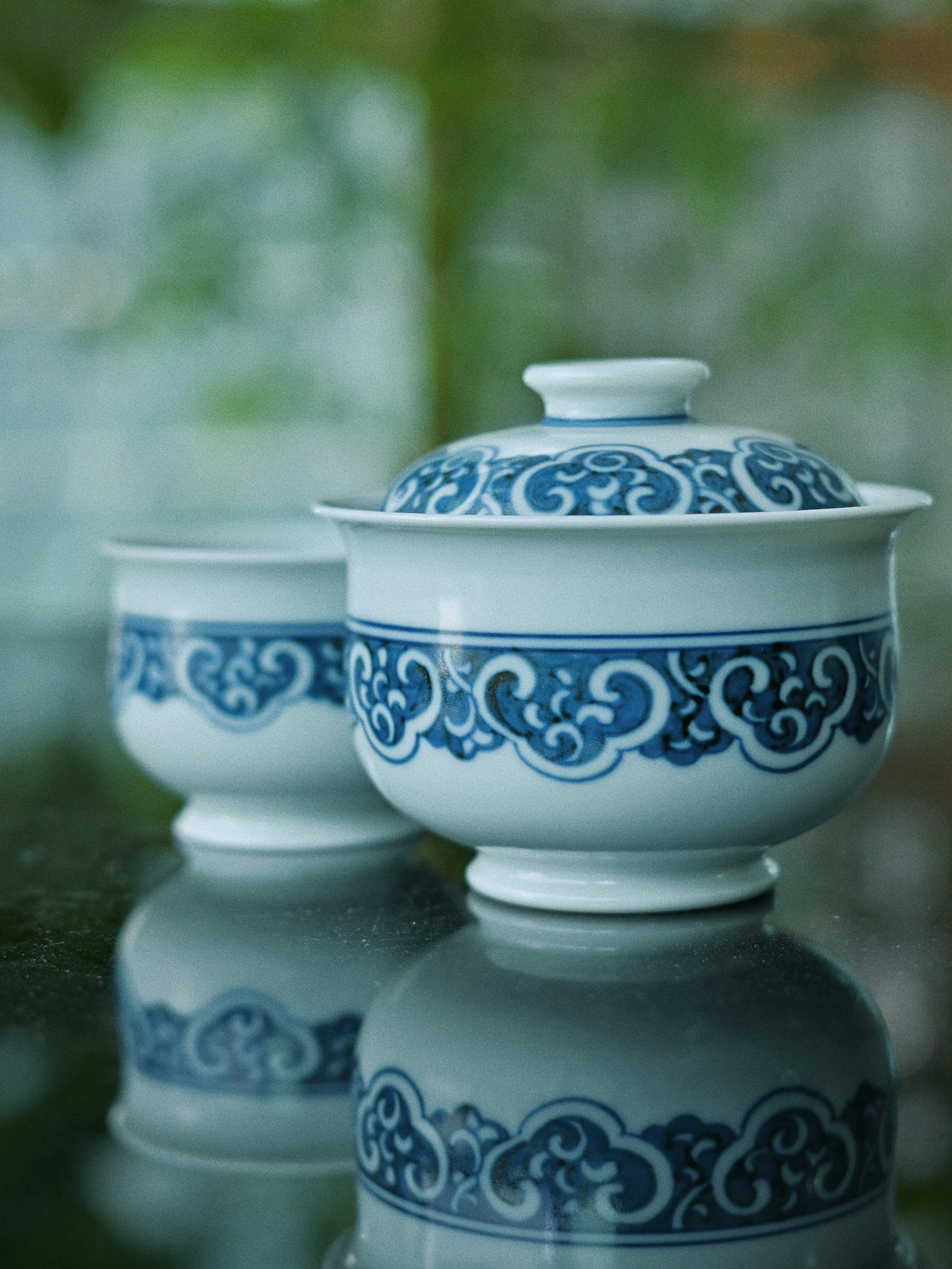 Master-crafted Jingdezhen gaiwan set with 12-step hand-painting process, three-layer gradient washes, and 1320°C reduction firing for imperial-quality blue-and-white porcelain.