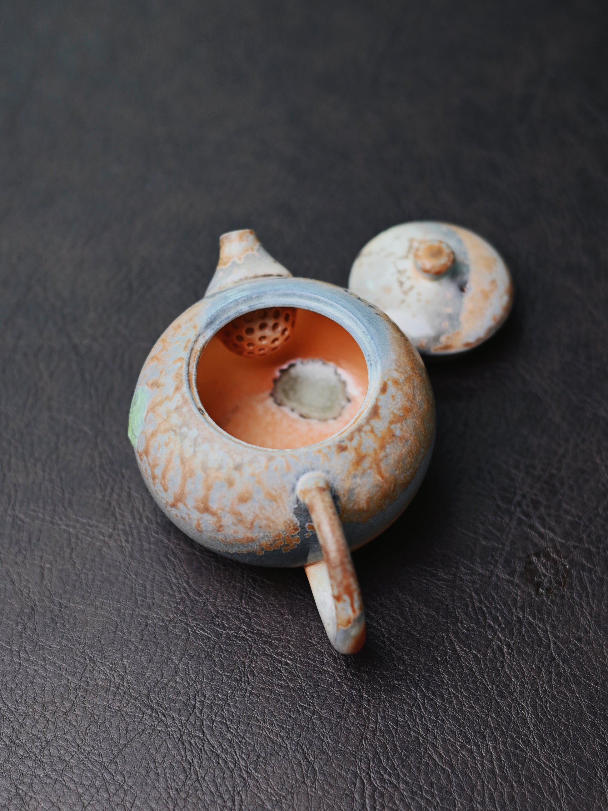Embracing imperfection: fully handmade Xishi teapot with random ash glazing, crystalline blooms, and flame markings from uncontrolled wood firing