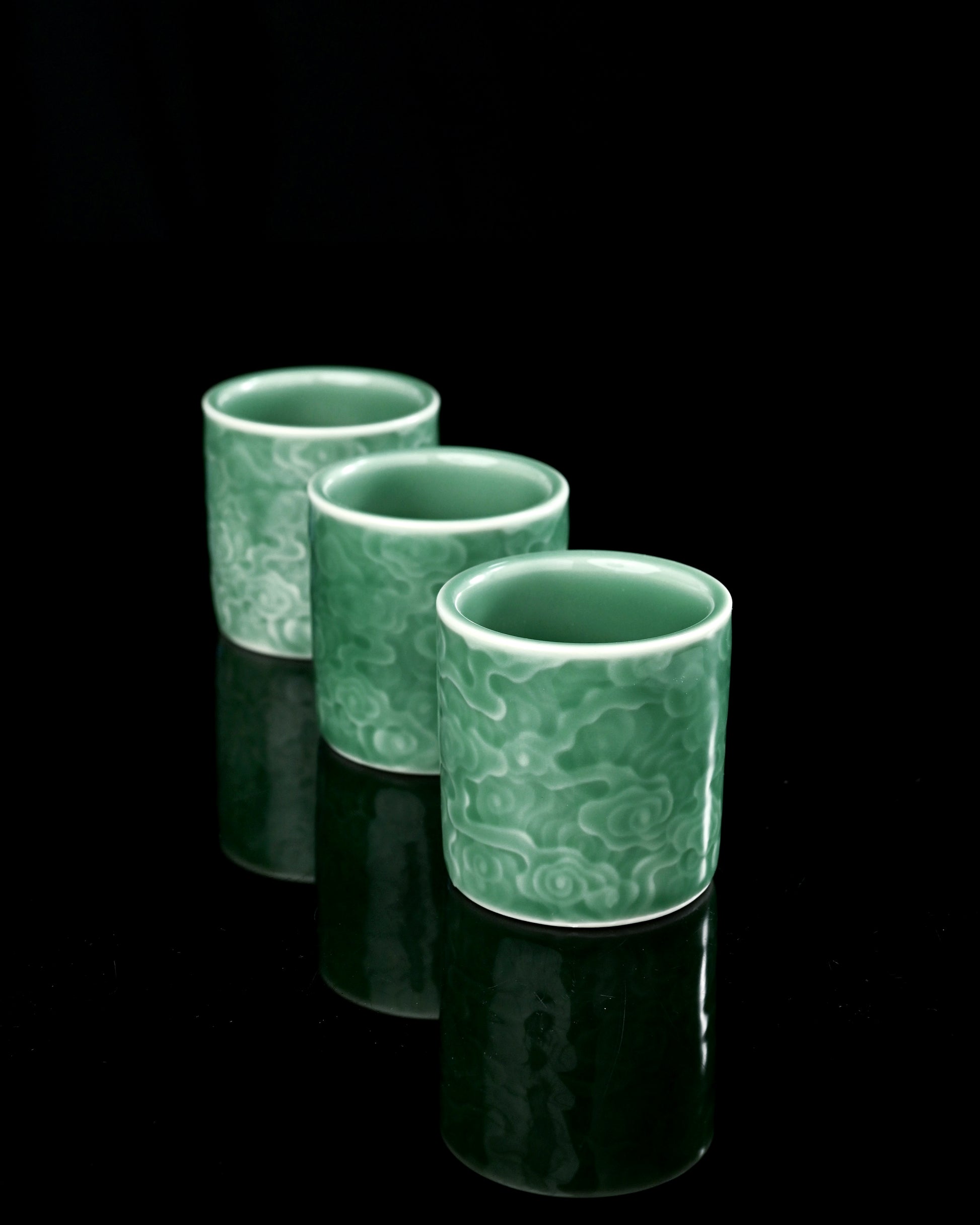 Experience timeless tranquility with our Longquan Celadon Cloud Embossed Cup.