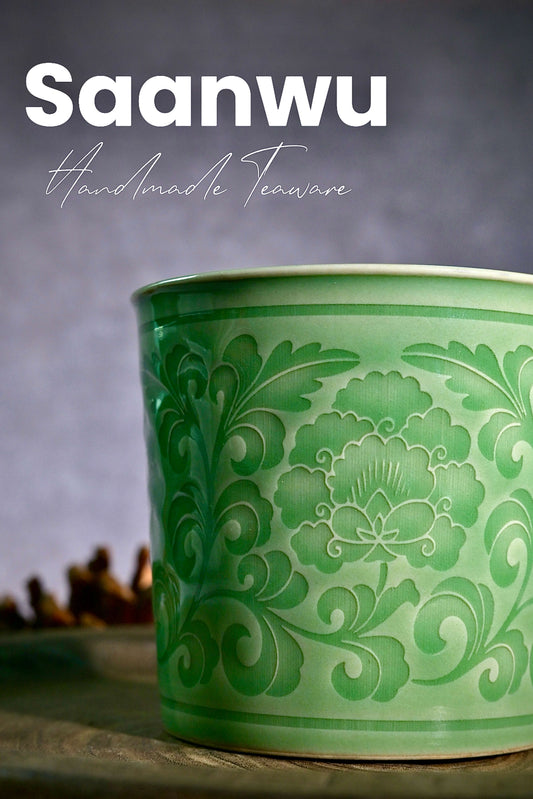 Close-up of the handcrafted peony relief carving on a Longquan Celadon cup.