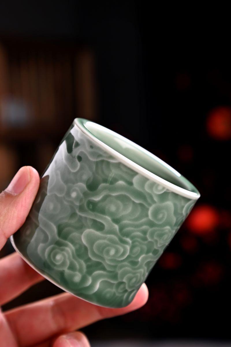 Rediscover ancient craftsmanship through the Longquan Celadon Cloud Relief Cup.