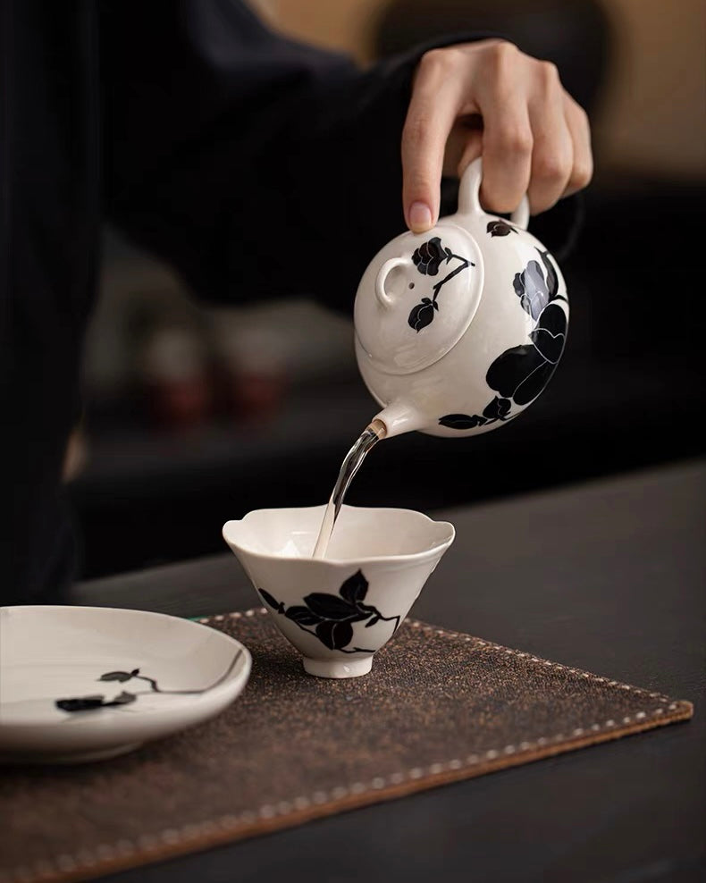 Minimalist magnolia teapot design featuring plant ash glaze and modern artistic aesthetic