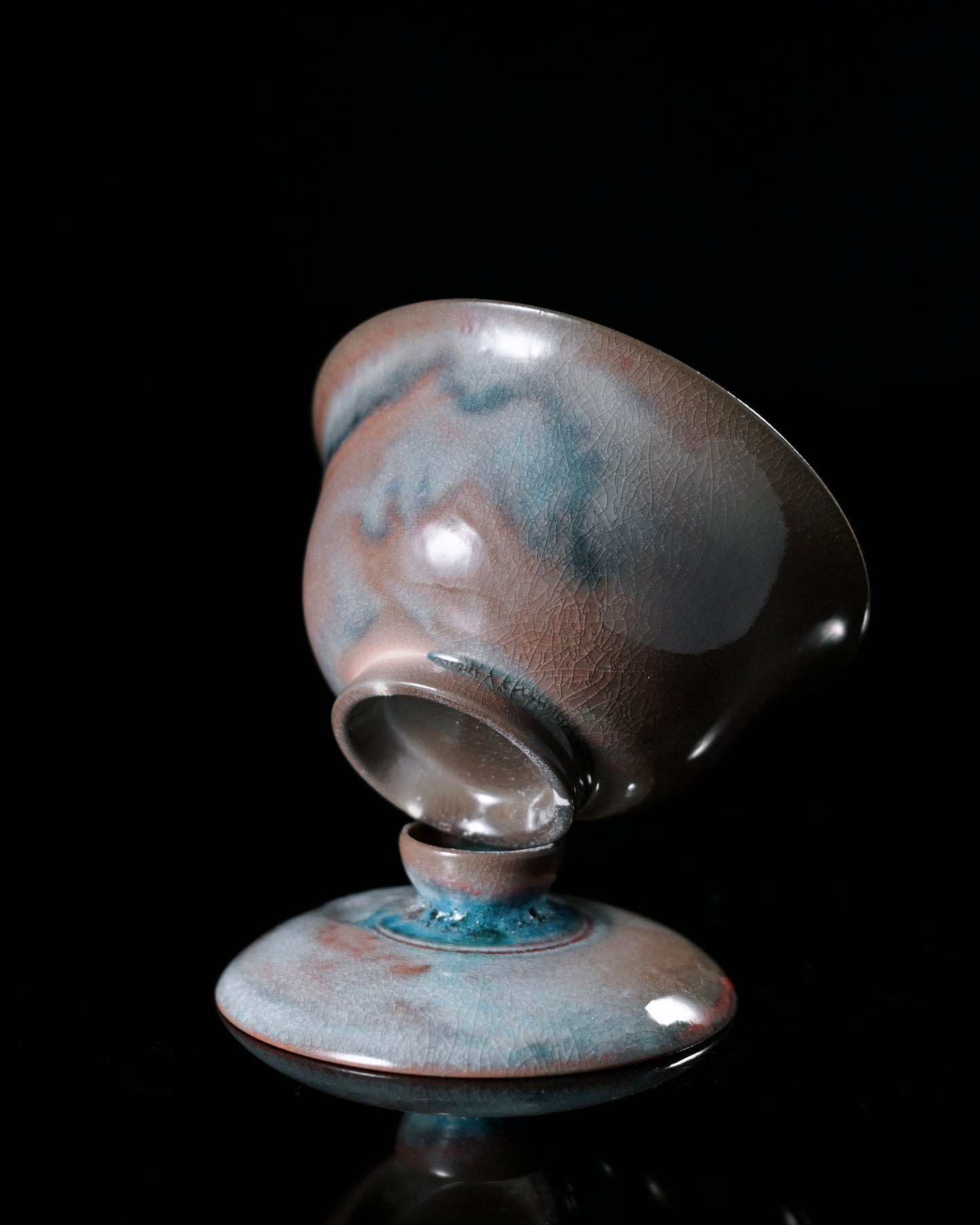 Kiln sweat adorned tea bowl with celestial glaze colors, perfect for personal tea tasting sessions