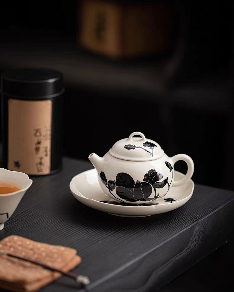 Plant ash glaze ceramic teapot featuring hand-painted magnolia bloom and spherical tea filter