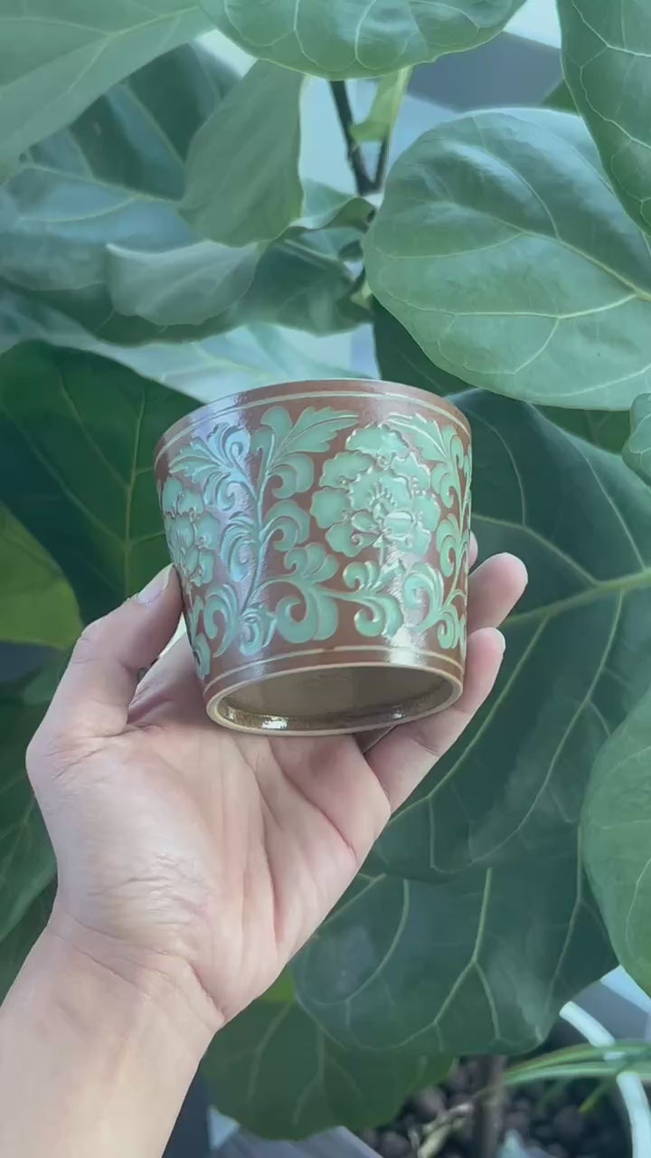 Jade-like Longquan celadon teacup with plant ash glaze and hand-carved peonies, 260ml capacity perfect for various beverages.