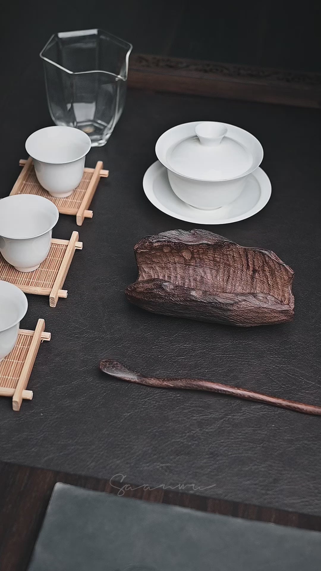 Natural wood tea scoop with organic shape, carbon treated surface and hand-polished edges