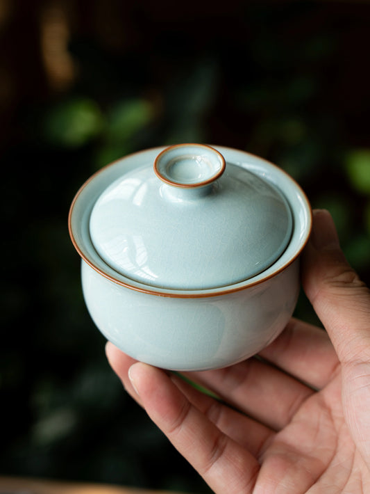 Handcrafted Ru Ware gaiwan in soft sky-blue celadon with fine crackle pattern