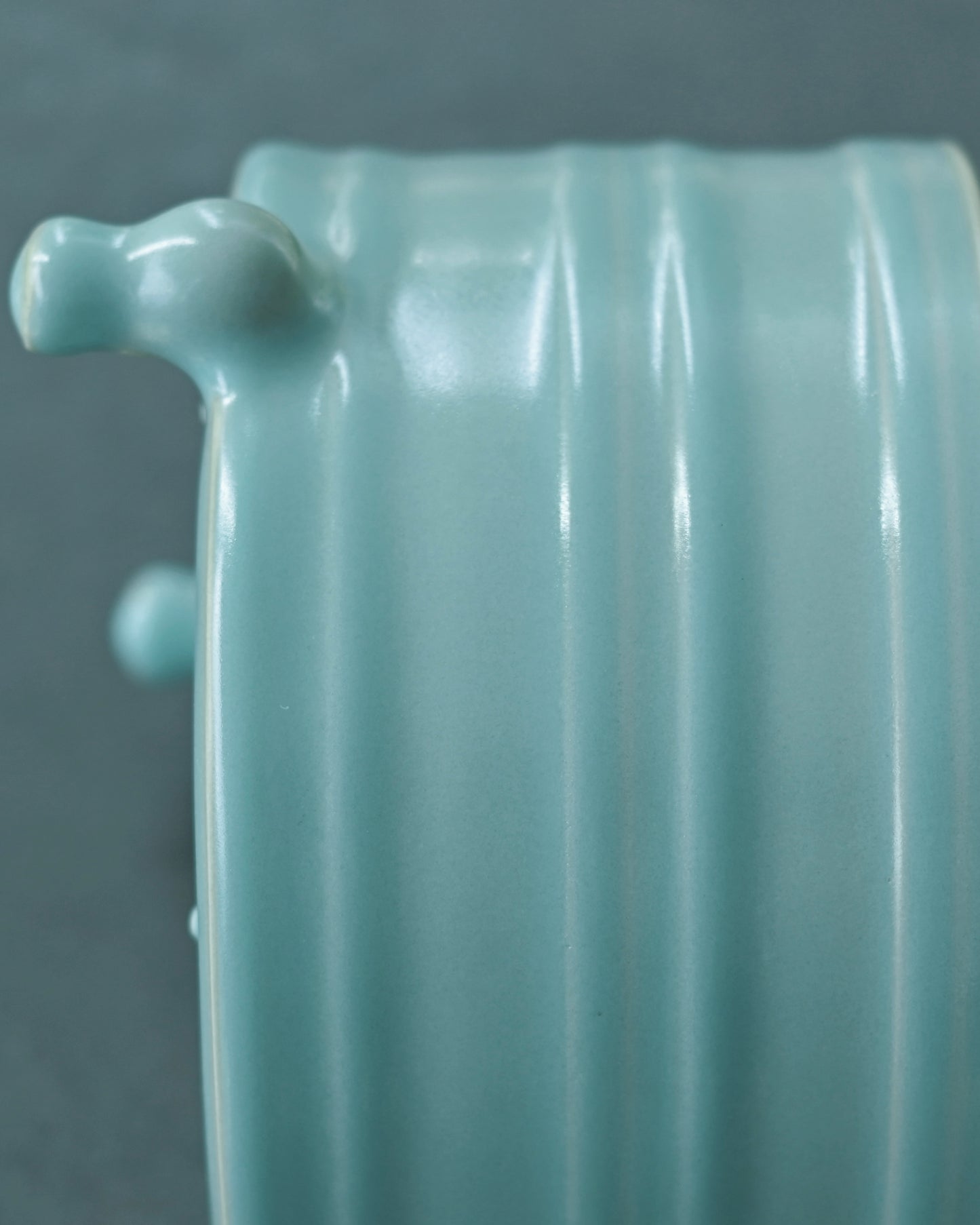 Rare crackle-free Ru ware tripod Zun with soft blue glaze and exposed incense ash clay details