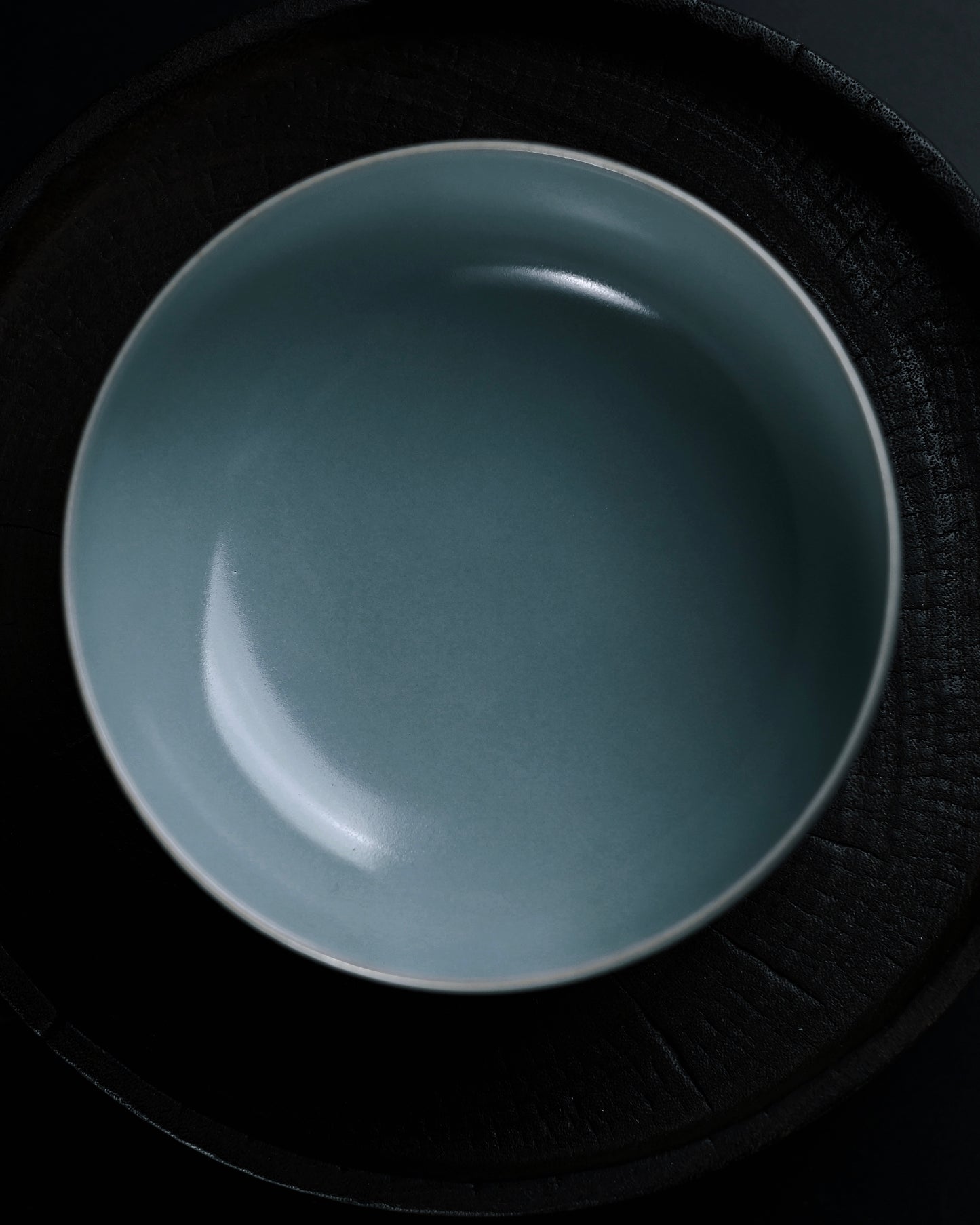 Traditional Ru ware three-pin fired tea bowl showing sesame-sized pin marks and crackle interior