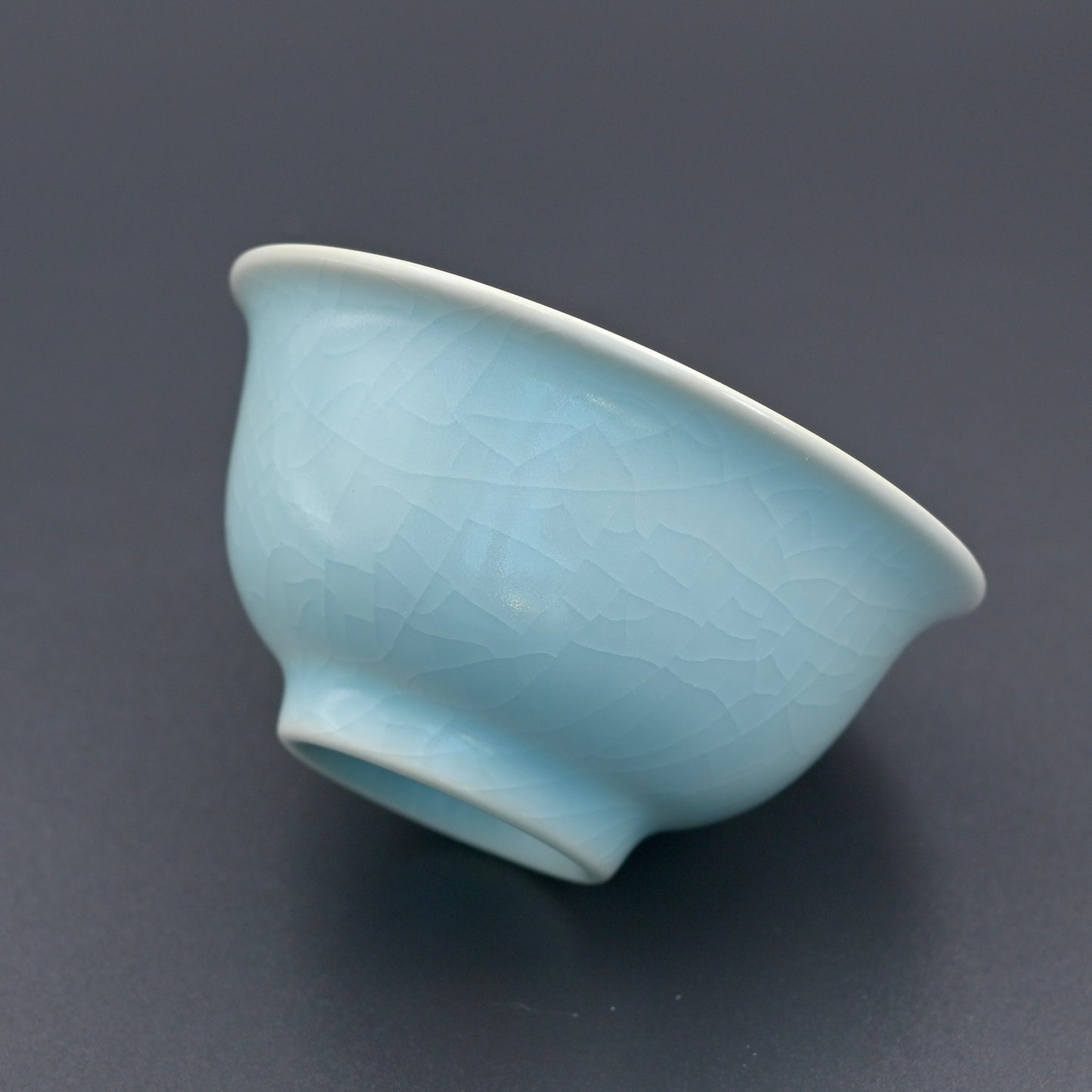 Vintage Ru porcelain tea cup with fine crackles that develop golden lines through tea immersion and aging