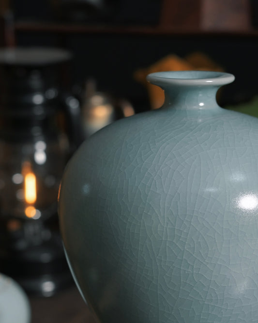 Delicate cicada-wing crackle pattern naturally formed during traditional Ru kiln firing