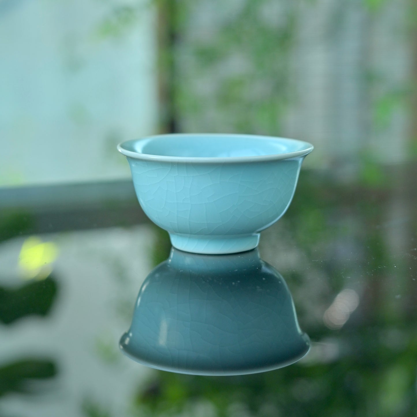 11th century inspired Ru porcelain cup with pure monochrome glaze, showing historical traces through tea use