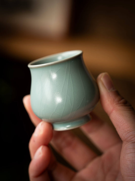 Luxury Chinese porcelain tea vessel showcasing the classic rain-cleared sky hue.