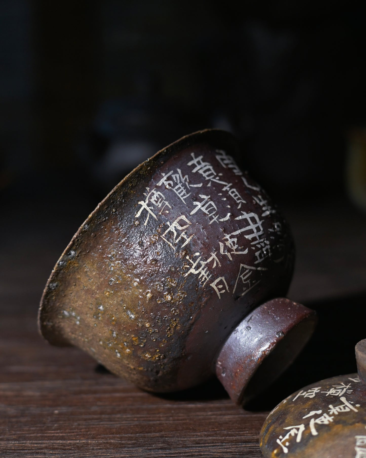 Running script tea poetry vessel with expressive brushstrokes varying from dark bold to light rapid lines