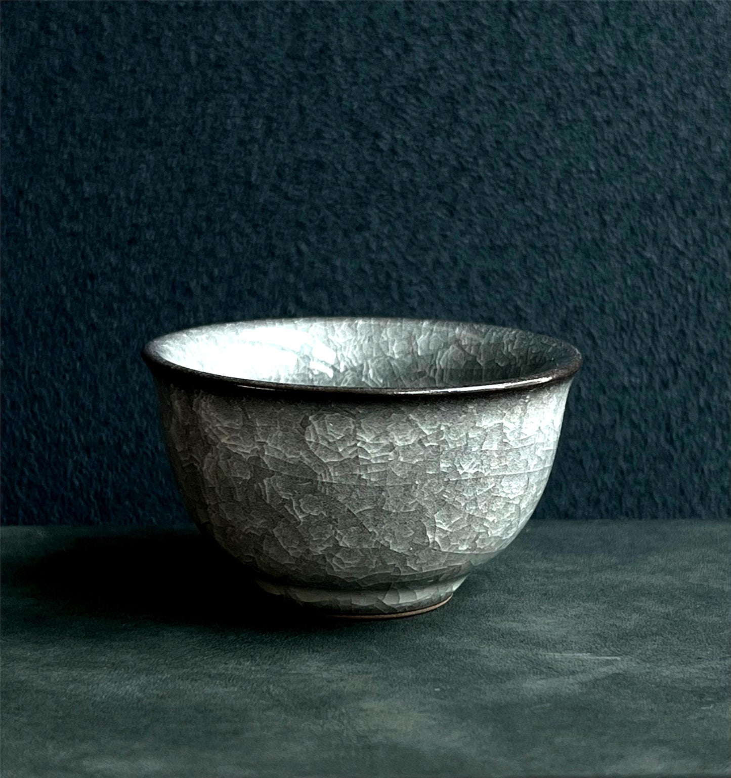 Longquan celadon tea ware with ice crackle pattern and ya shou weighted base for enhanced tea experience