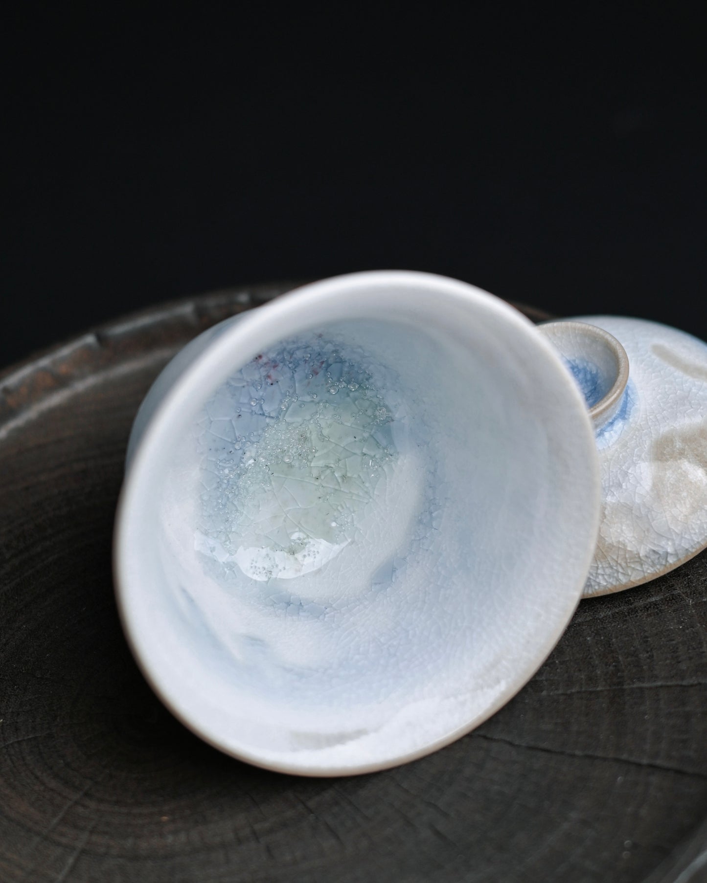 Small wood-kiln gaiwan with crystal formations and blue-white crackle glaze, handmade from kaolin clay
