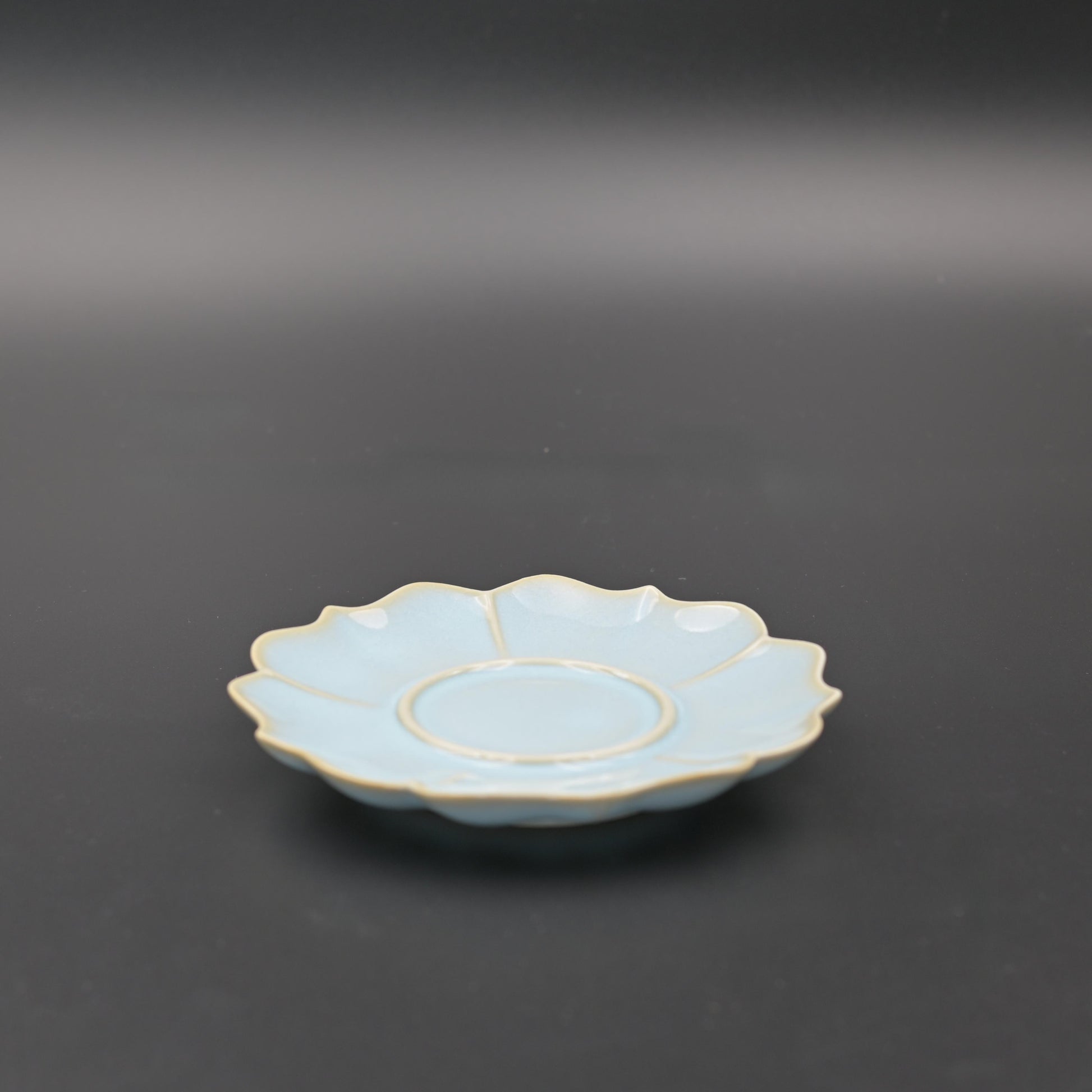 Traditional Ru ware style saucer with fluted sunflower edge and celestial blue glaze, perfect for tea ceremony use and cup protection